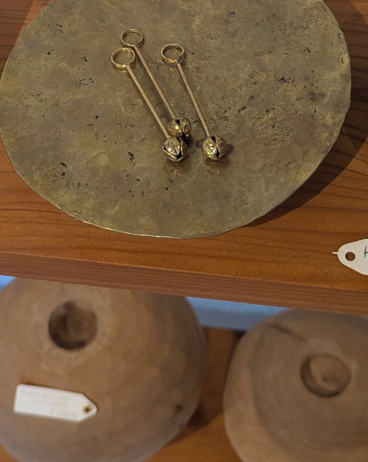 Brass pendants with bud-shaped bells
